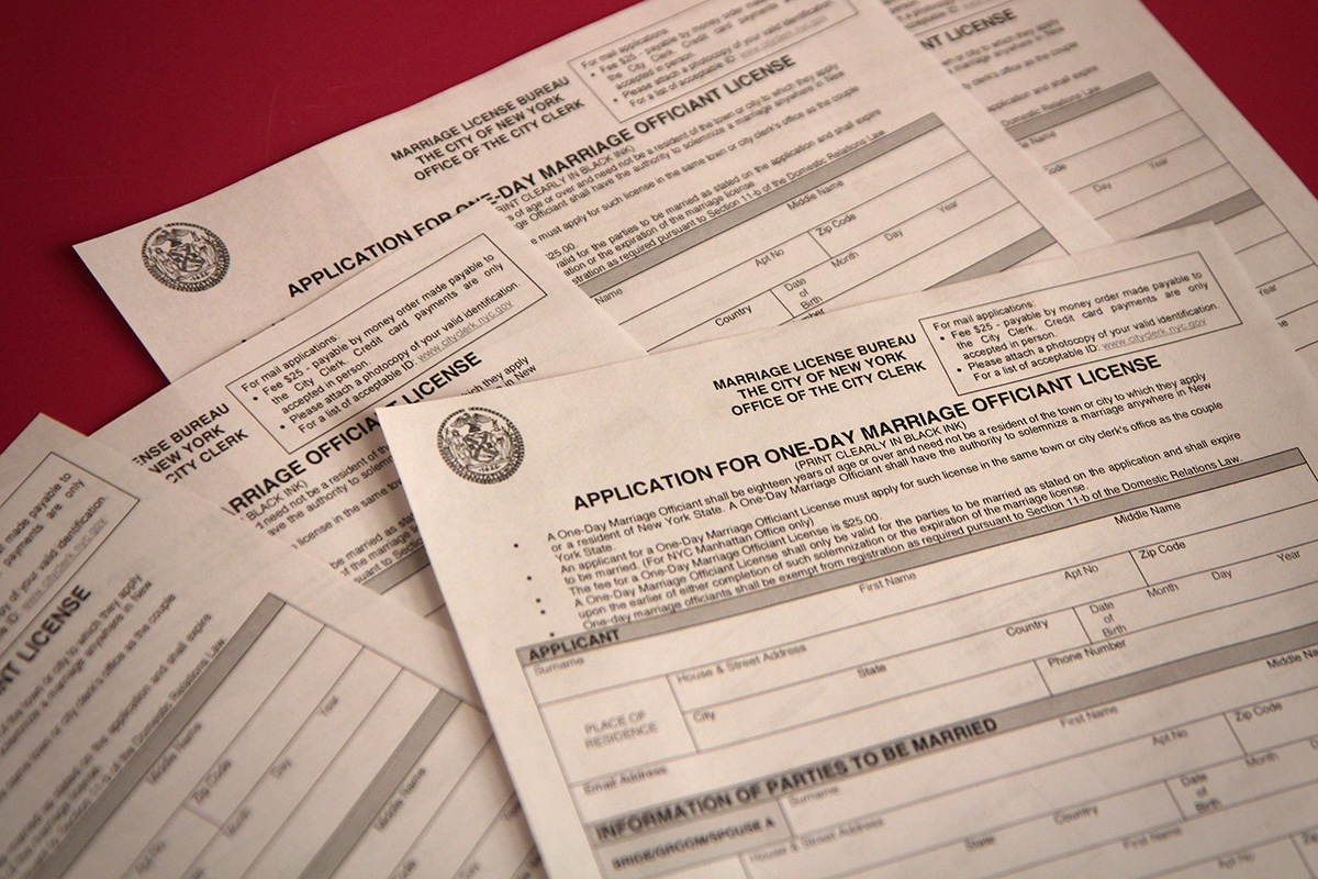 Marriage officiant certificates on a table.